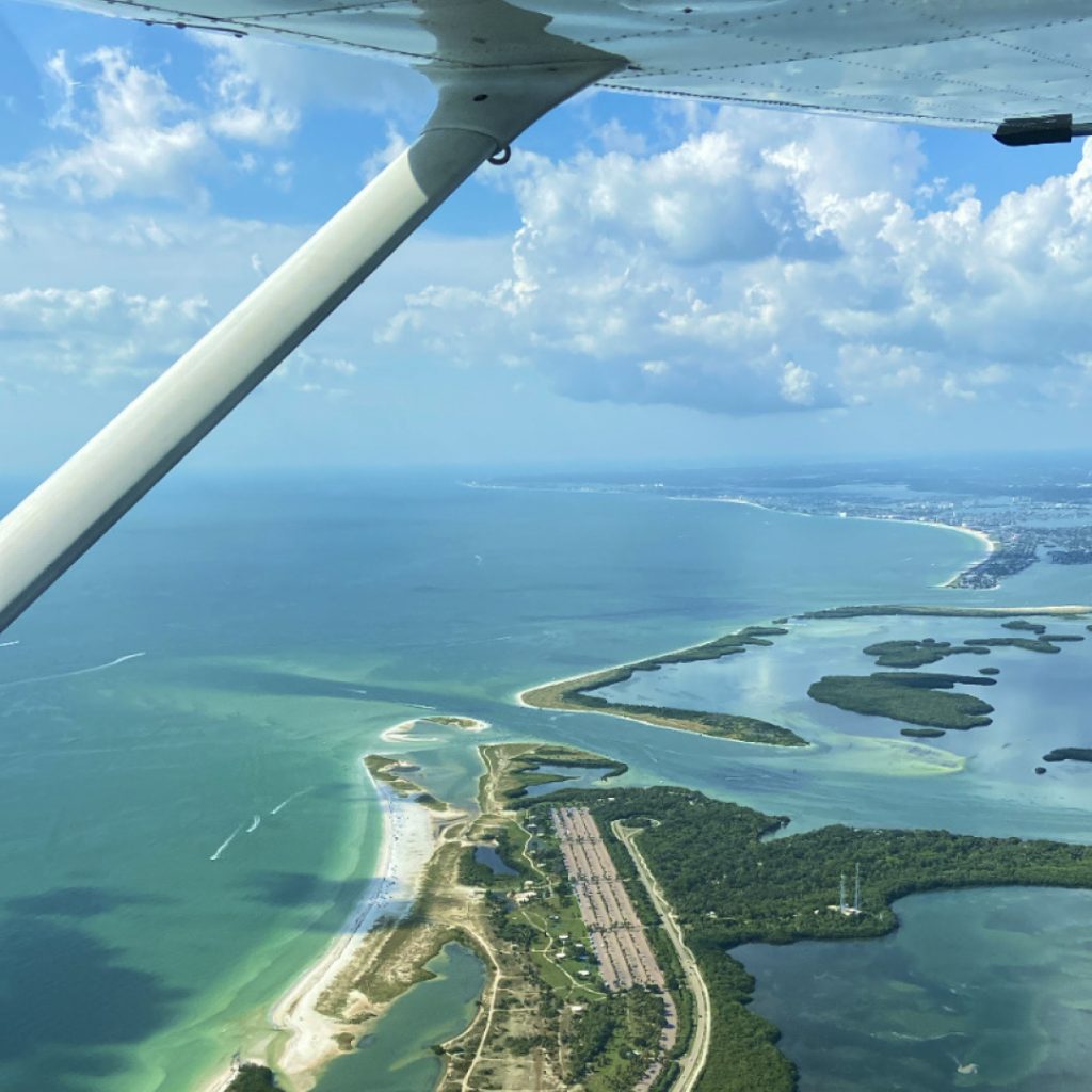 plane flying over Miami