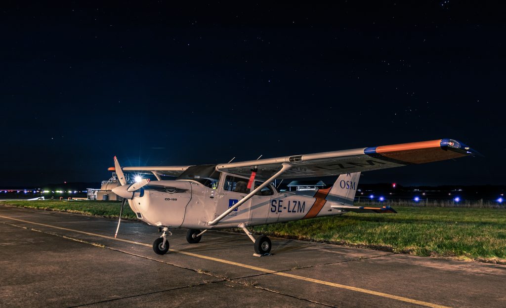 Cessna parked during night-time