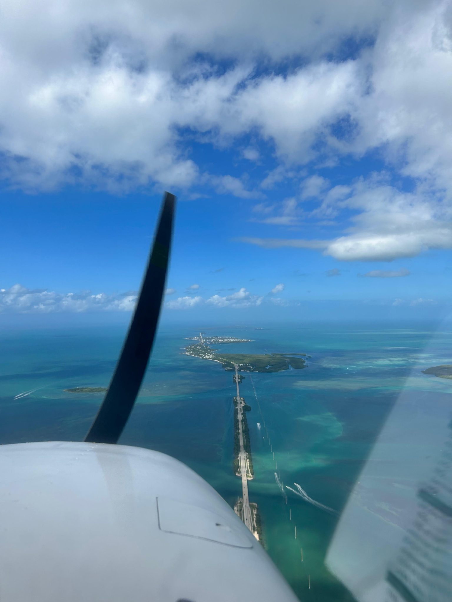 Cessna flying above water in Florida