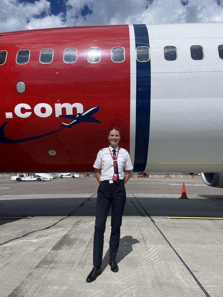 Woman in front of b737 plane