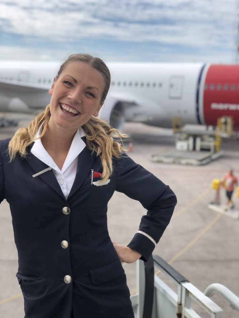 Woman in front of b737 plane