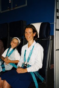 a owman and child in a plane